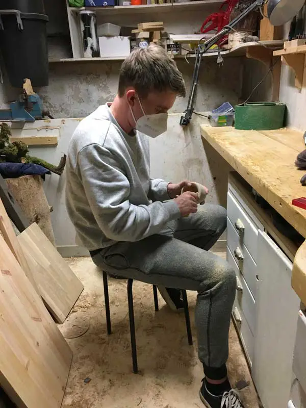 Man woodworking, Making a tea cup